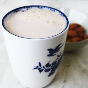 Almond milk in white and blue mug