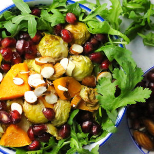 Roasted Brussels sprouts sweet potato salad with crunchy almonds and pomegranates