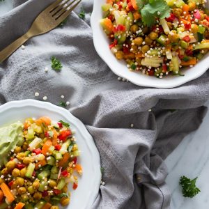 Mixed raw salad with crispy curried chickpeas and creamy avocado dressing